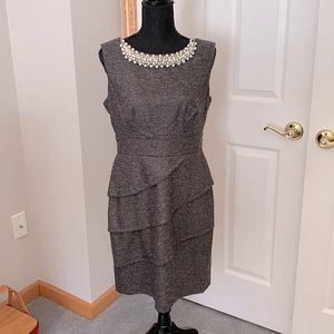 Charcoal gray dress with pearl embellishments at neckline